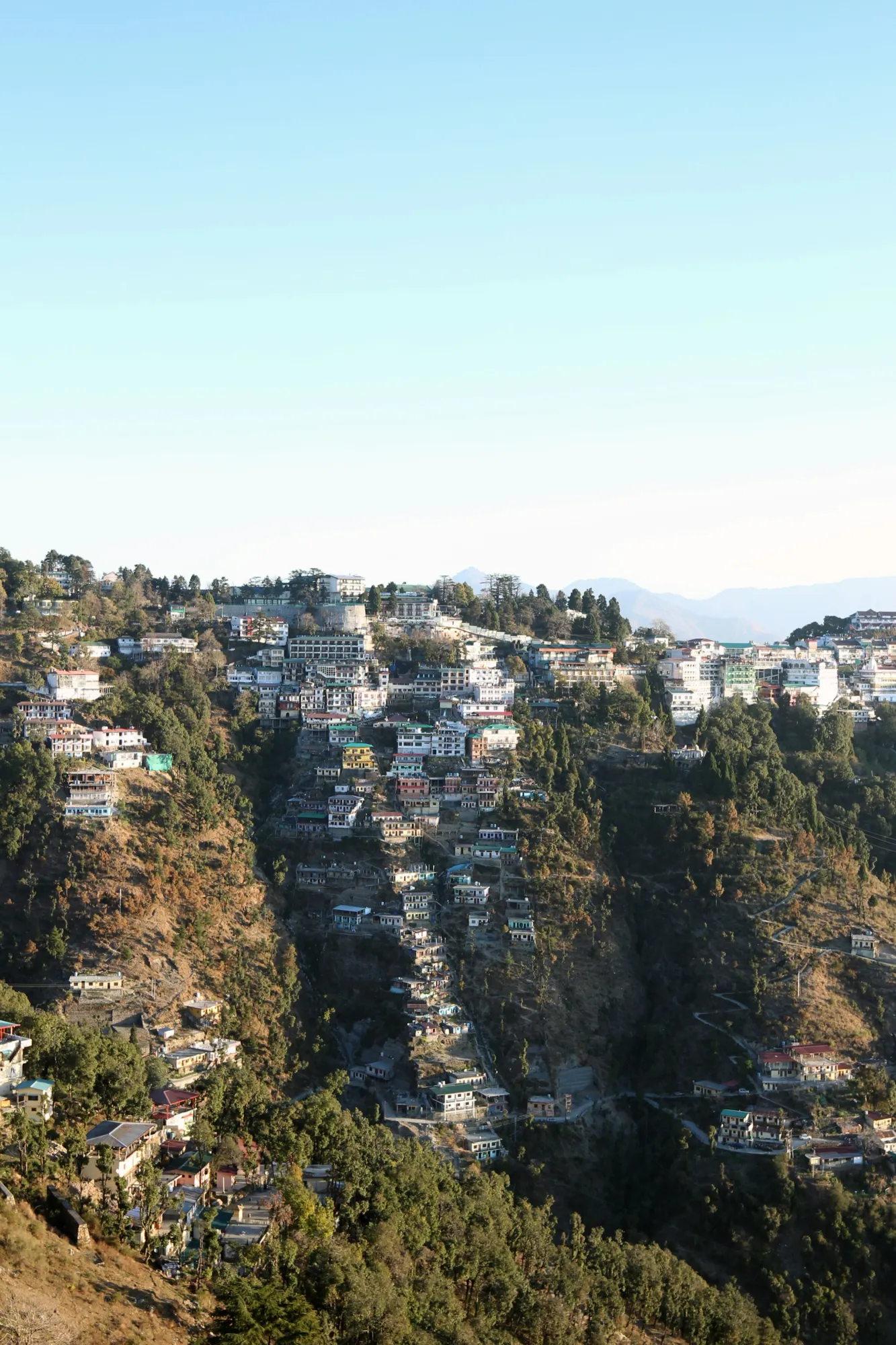 Aerial view of Mussoorie spread along a forested Himalayan ridge